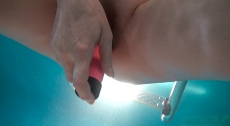 Horny granny Jitka masturbating in the pool during a nude swim session