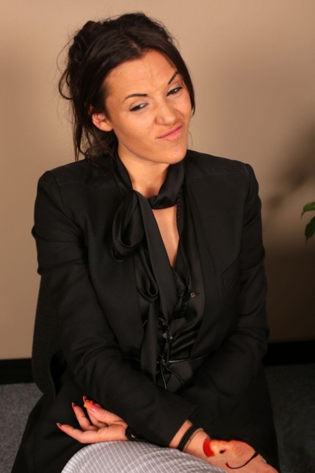 Brunette Bella Fuentes flashes her boob & stockings during the job interview