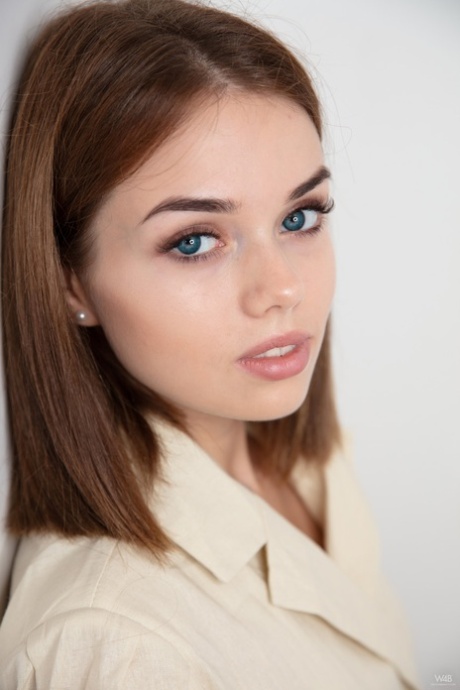 Glamorous teen Keira Blue strips her sexy coat off and spreads her cute beaver
