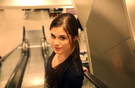 Slim teen Little Caprice poses in stockings & chocolate at a photo shoot