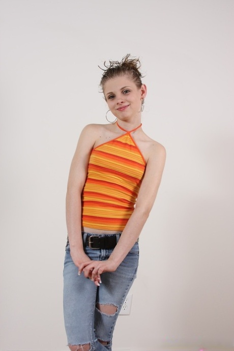 Sweet teen with a petite figure Lil Candy flaunts her love holes on the floor