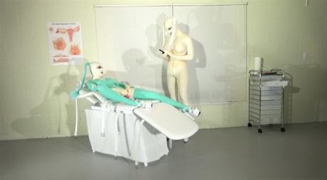 Kinky Latex Lara in full body latex gets toyed by a busty latex-clad doctor