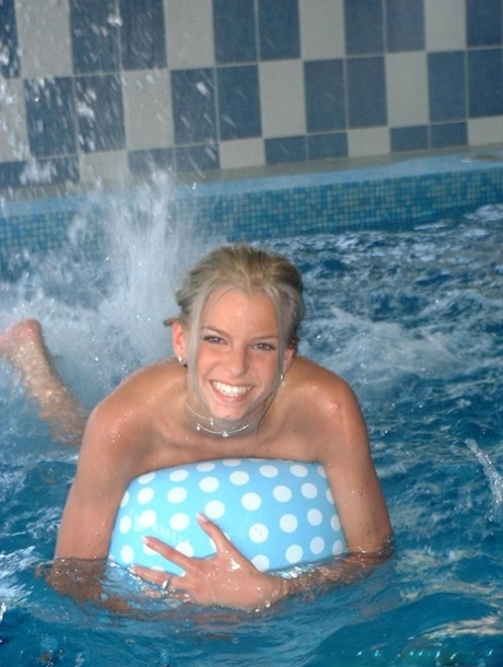 Sweet blonde teen Lilu plays naked in the pool before posing with two guys