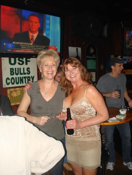 Sexy amateur wives show off their big tits and pussies at a nightclub