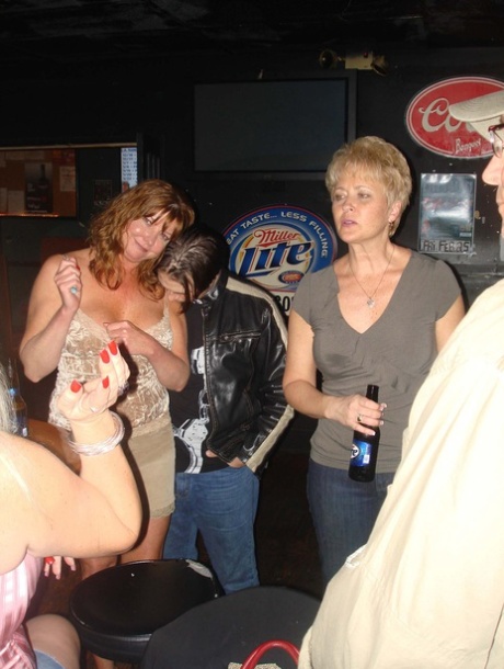 Sexy amateur wives show off their big tits and pussies at a nightclub