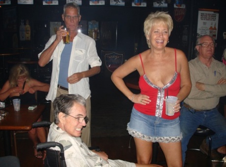 Mature sluts give arousing pantyless upskirts & show their titties in public