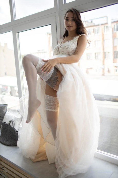 Beautiful teenage bride Medina strips to her stockings & teases with her tits
