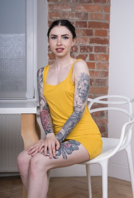 Inked American Babychocolate undresses and fucks a purple toy in a solo