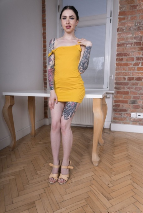 Inked American Babychocolate undresses and fucks a purple toy in a solo