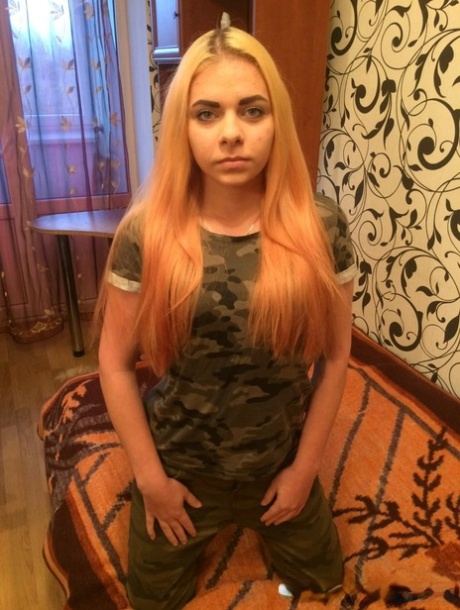 Redheaded beauty loses her military outfit and shows her big ass & boobs
