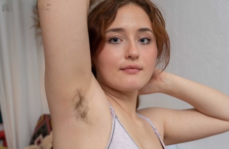 Amateur honey with hairy armpits Elza shows her big tits and bushy beaver