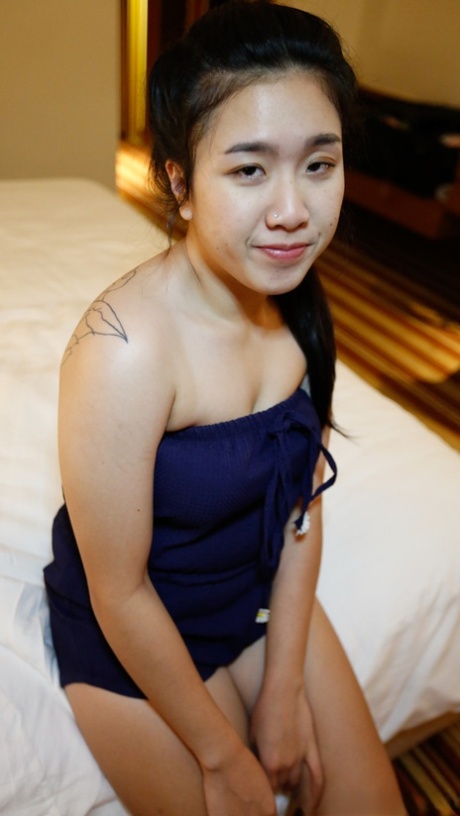 Petite Thai girl Hnin flaunts her big tits and ass before a POV pounding