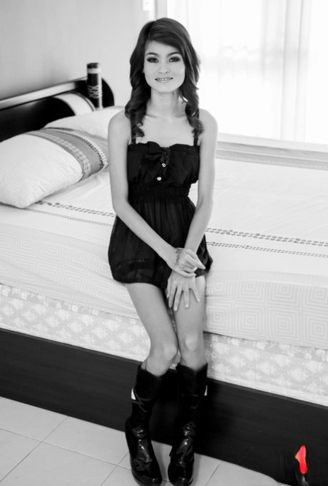 Skinny Thai model Jasmine strips to her boots and poses in a solo