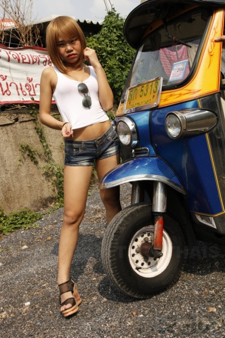 Sexy Asian girls Potay and Candy strip and play with a purple sex toy