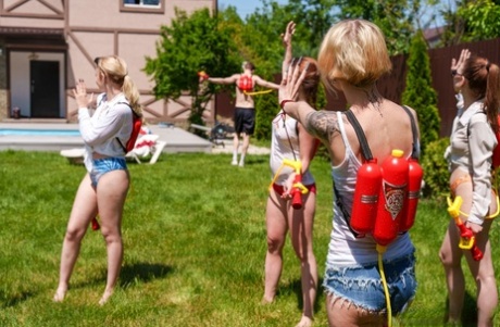 Slutty babes give each other a pussy licking in a wild outdoor orgy