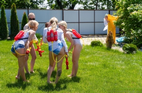 Slutty babes give each other a pussy licking in a wild outdoor orgy