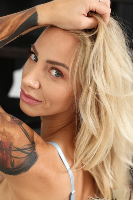 Blonde bombshell Nathaly Cherie shows off her stunning tits & her big ass