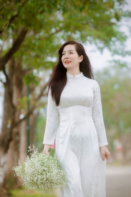 Breathtaking Asian model posing in her sexy dresses in public in a solo