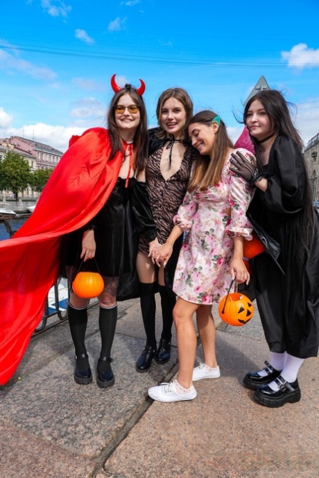 Playful teens getting involved in a kinky Halloween lesbian orgy