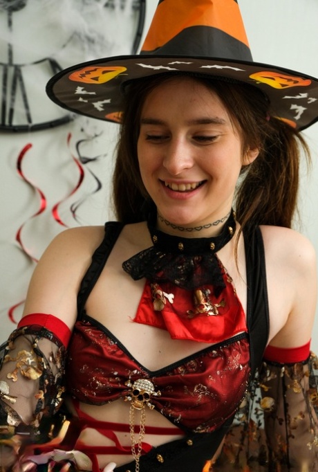Playful teens getting involved in a kinky Halloween lesbian orgy