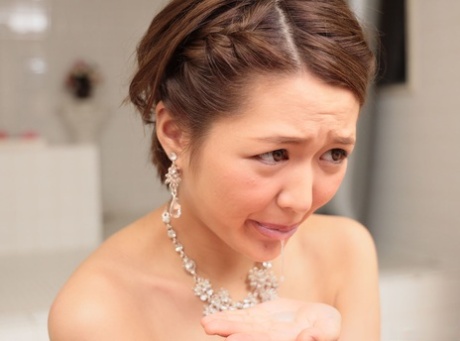 Sexy Asian babe Mai Yoshino shows her creampied shaved pussy after sex