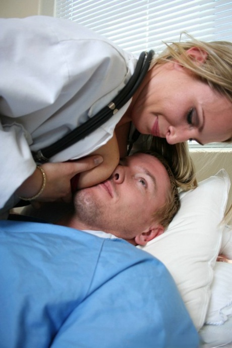 Blonde nurse Harmony Rose gives her patient a blowjob before riding his dick