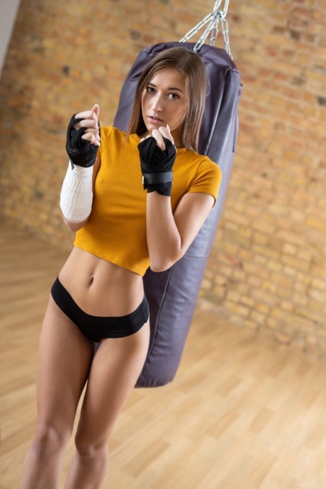 Sexy athlete Mina strips and masturbates after her boxing practice